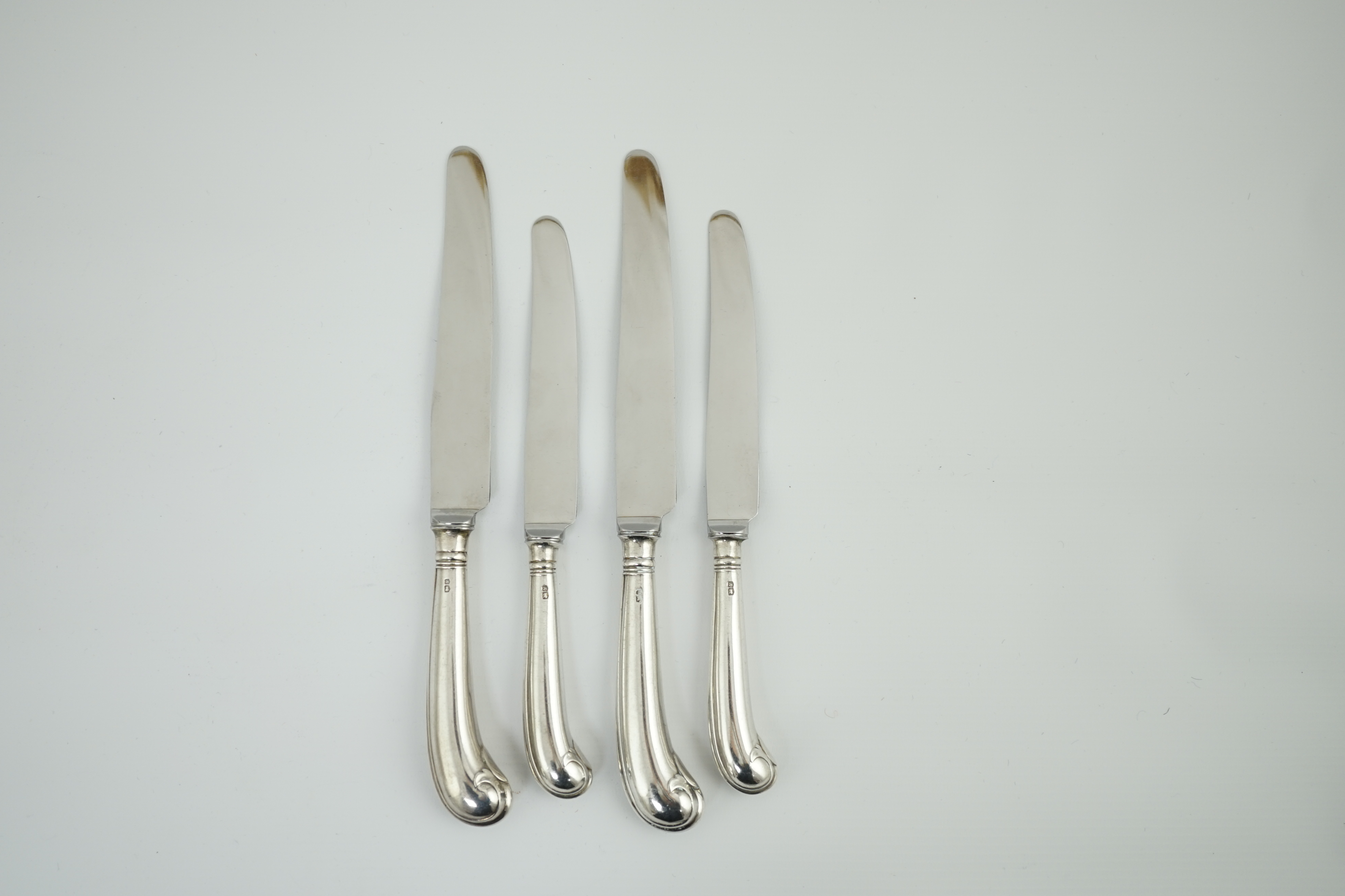 A set of six Elizabeth II silver handled table knives and six dessert knives, by George Howson